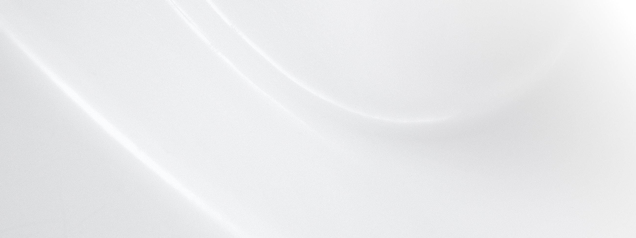 Abstract white curved surface with soft shadows.