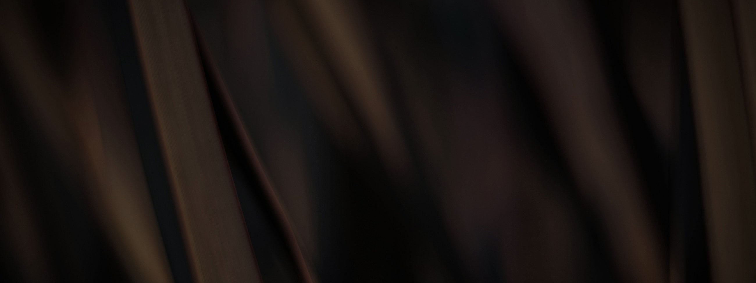 Abstract dark brown textured background.