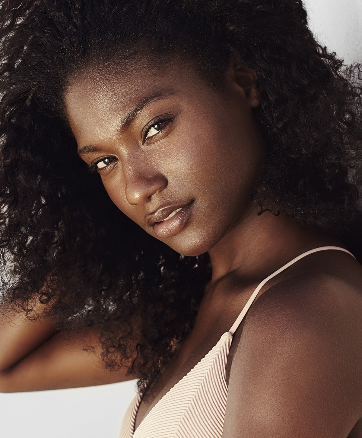 Portrait of a woman with curly hair.