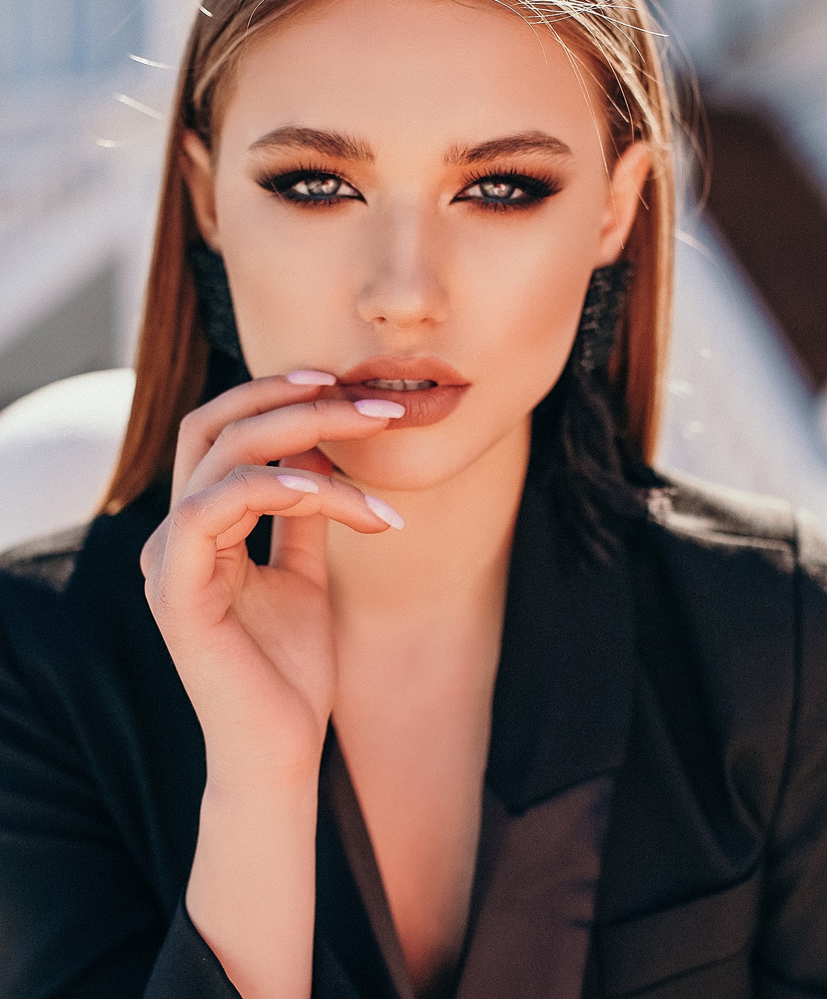 Close-up of a woman with striking makeup.
