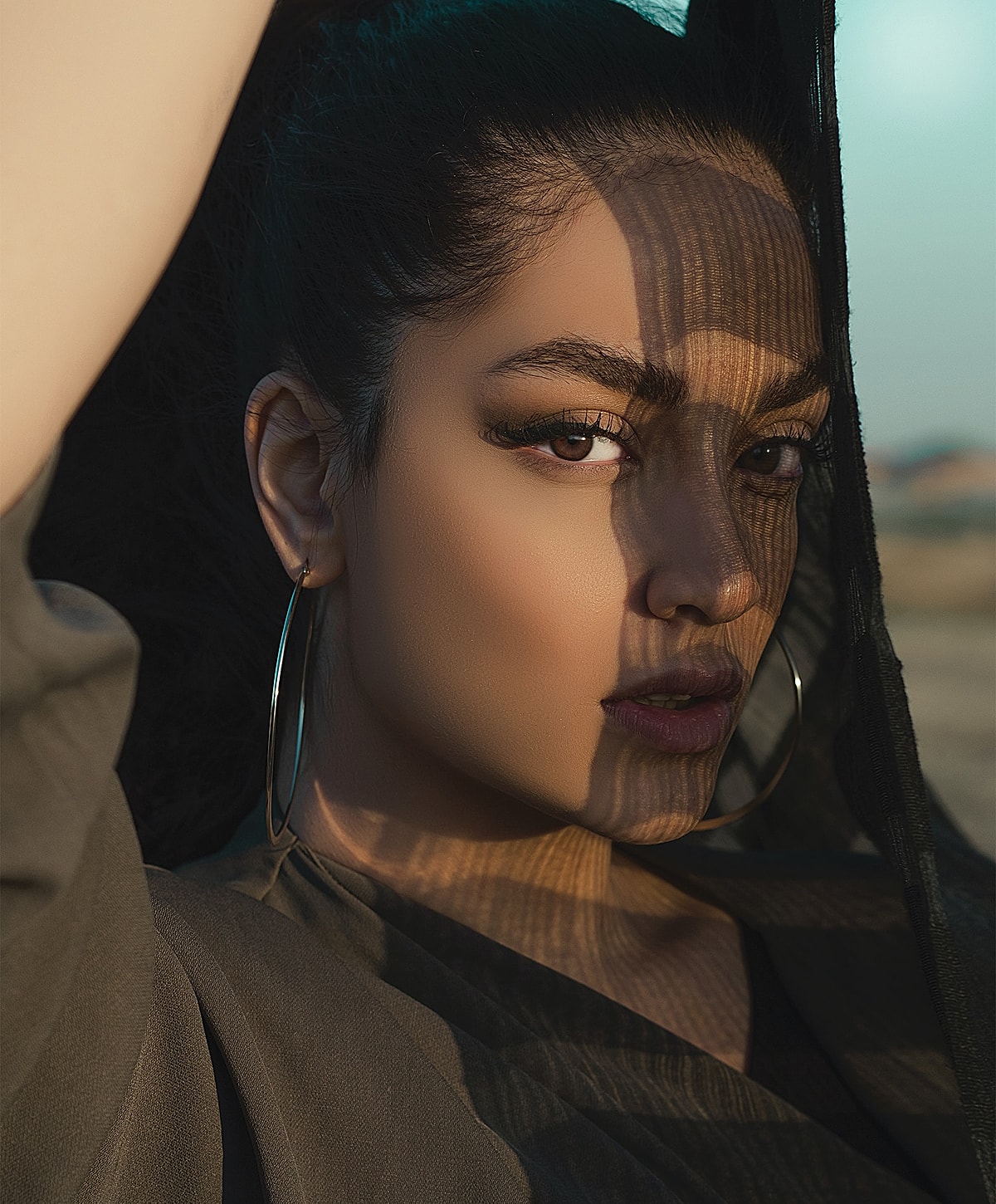 Portrait of a woman with shadow patterns.